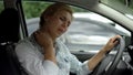 Female driver feeling neck pain, back muscle inflammation, sedentary lifestyle