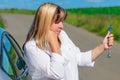 Female driver is looking at spanner Royalty Free Stock Photo