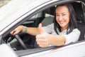 Female driver showing thumbs up