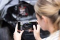 Female Driver Taking Photo Of Damaged Car After Accident For Insurance Claim On Mobile Phone Royalty Free Stock Photo