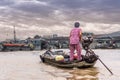 Female driving boat in canals of southern vietnam