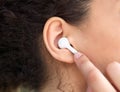 Female ear with earphone Royalty Free Stock Photo