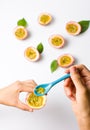 Female eating Passion fruit with a spoon Royalty Free Stock Photo