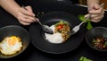 Female eating Stir fried minced pork with basil Pad ka prao, fried egg and chili fish sauce in Thai restaurant Royalty Free Stock Photo