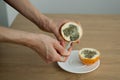 Female eats fresh organic ripe granadilla or yellow passion fruit with a spoon. Exotic fruits, healthy eating concept Royalty Free Stock Photo