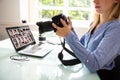Female Editor Holding DSLR Camera