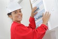 Female electrician installing energy saving meter Royalty Free Stock Photo