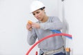 female electrician installing wall socket Royalty Free Stock Photo