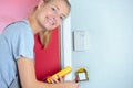 Female electrician installing wall socket Royalty Free Stock Photo