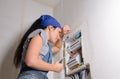 Female electrician with open fuse