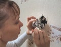 Female electrician repair the outlet on the wall. Royalty Free Stock Photo