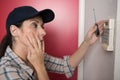 female electrician repairing intercom Royalty Free Stock Photo