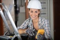 female electrician testing charge electric circuit Royalty Free Stock Photo