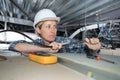 Female electrician wiring inside ceiling Royalty Free Stock Photo