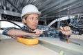 Female electrician working on false ceiling Royalty Free Stock Photo