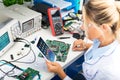 Female electronic engineer using tablet computer in laboratory Royalty Free Stock Photo