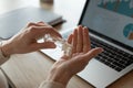 Female employee cleanse hands with sanitizer at workplace Royalty Free Stock Photo