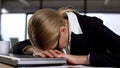 Female employee lying on laptop, annoyed with work, nervous breakdown, stress Royalty Free Stock Photo