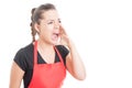 Female employee shouting out loud at somebody