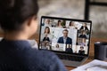 Female employee talk on video call with colleagues Royalty Free Stock Photo