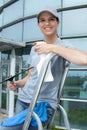 Female employee windows cleaner posing on stepladder Royalty Free Stock Photo