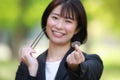 Female employee with 3 100-yen coins and chopsticks Royalty Free Stock Photo