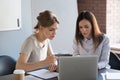 Female employees discussing working together on business project Royalty Free Stock Photo