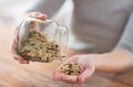 Female emptying jar with white and wild black rice Royalty Free Stock Photo