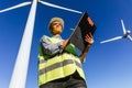 Female energy engineer works with wind turbines
