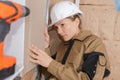Female engineer checking level wall Royalty Free Stock Photo