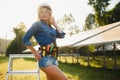 Female engineer developing project on installation of solar panels outdoors Royalty Free Stock Photo