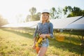 Female engineer developing project on installation of solar panels outdoors Royalty Free Stock Photo