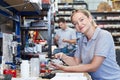 Portrait Of Female Engineer In Factory Measuring Component At Work Bench Using Micrometer Royalty Free Stock Photo
