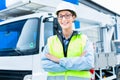 Female engineer in front of truck on site Royalty Free Stock Photo