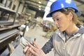 Female engineer in metallurgic factory with tablet Royalty Free Stock Photo