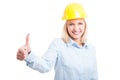 Female engineer showing like gesture and smiling Royalty Free Stock Photo