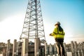 A female engineer is standing and inspecting the progress of the pillar installation Royalty Free Stock Photo
