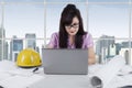 Female engineer working at desk in office Royalty Free Stock Photo