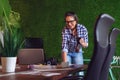 Female engineer working in her office with a cup of coffee in hands Royalty Free Stock Photo