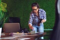 Female engineer working in her office with a cup of coffee in hands. - Image Royalty Free Stock Photo