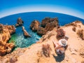 Female enjoying the beautiful view, Ponta da Piedade, a scenic spot in Portugal