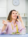 Female is enjoying tasty green salad Royalty Free Stock Photo