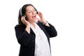 Female entrepreneur listening to music in headphones singing Royalty Free Stock Photo