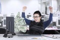 Female entrepreneur looking money on screen Royalty Free Stock Photo