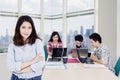 Female entrepreneur looks confident with her team Royalty Free Stock Photo