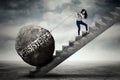 Female entrepreneur pulling persistence word on stair Royalty Free Stock Photo