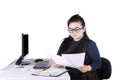 Female entrepreneur reading paperwork