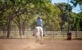 Cowgirl Competing In Barrel Racing Competition At Country Rodeo Royalty Free Stock Photo