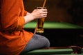 Female evening in billiard club. Girl drinking beer beside billiard table in bar. Royalty Free Stock Photo