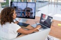 Female executive working over graphic tablet at her desk Royalty Free Stock Photo